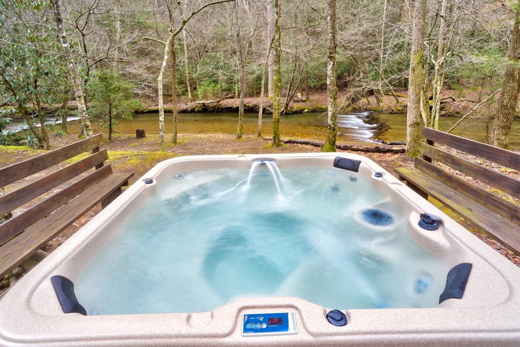 Hot Tub with Flowing River Behind It