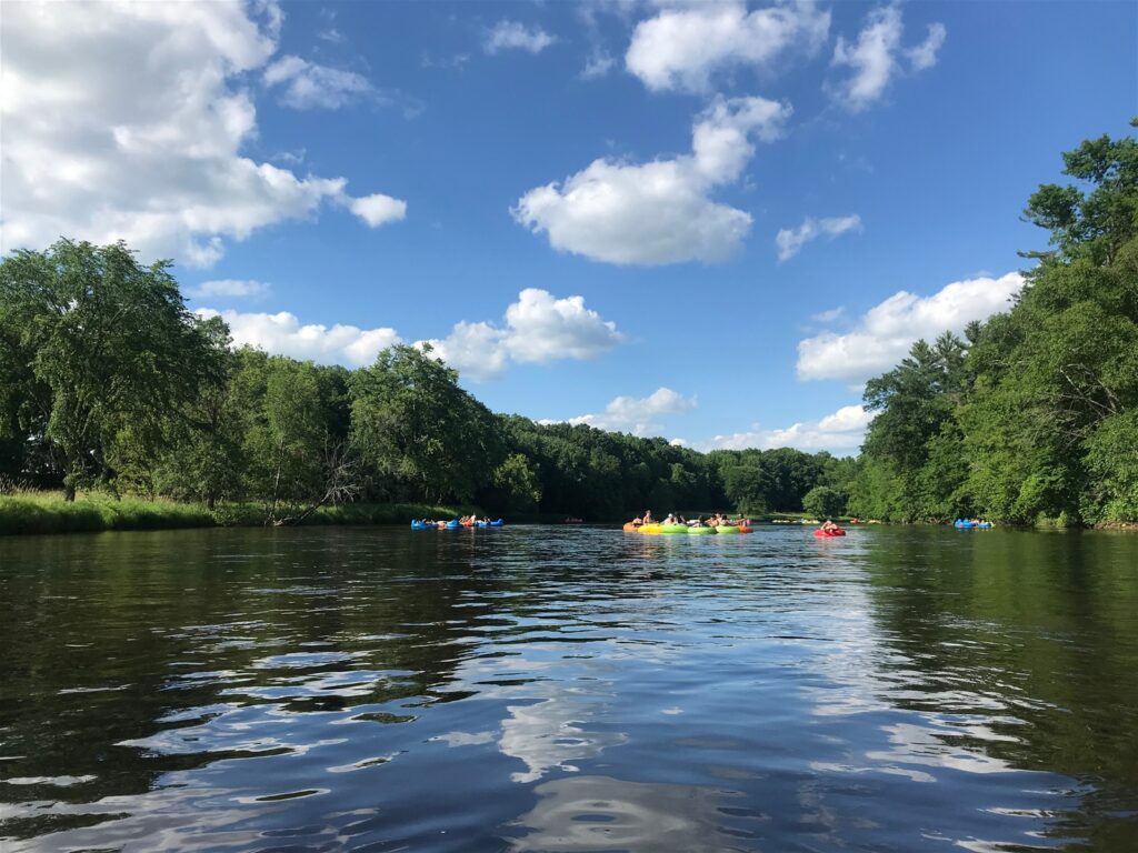 Group of Girlfriends Tubing Down the River