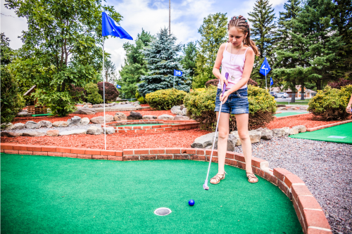 Girl playing Mini Golf